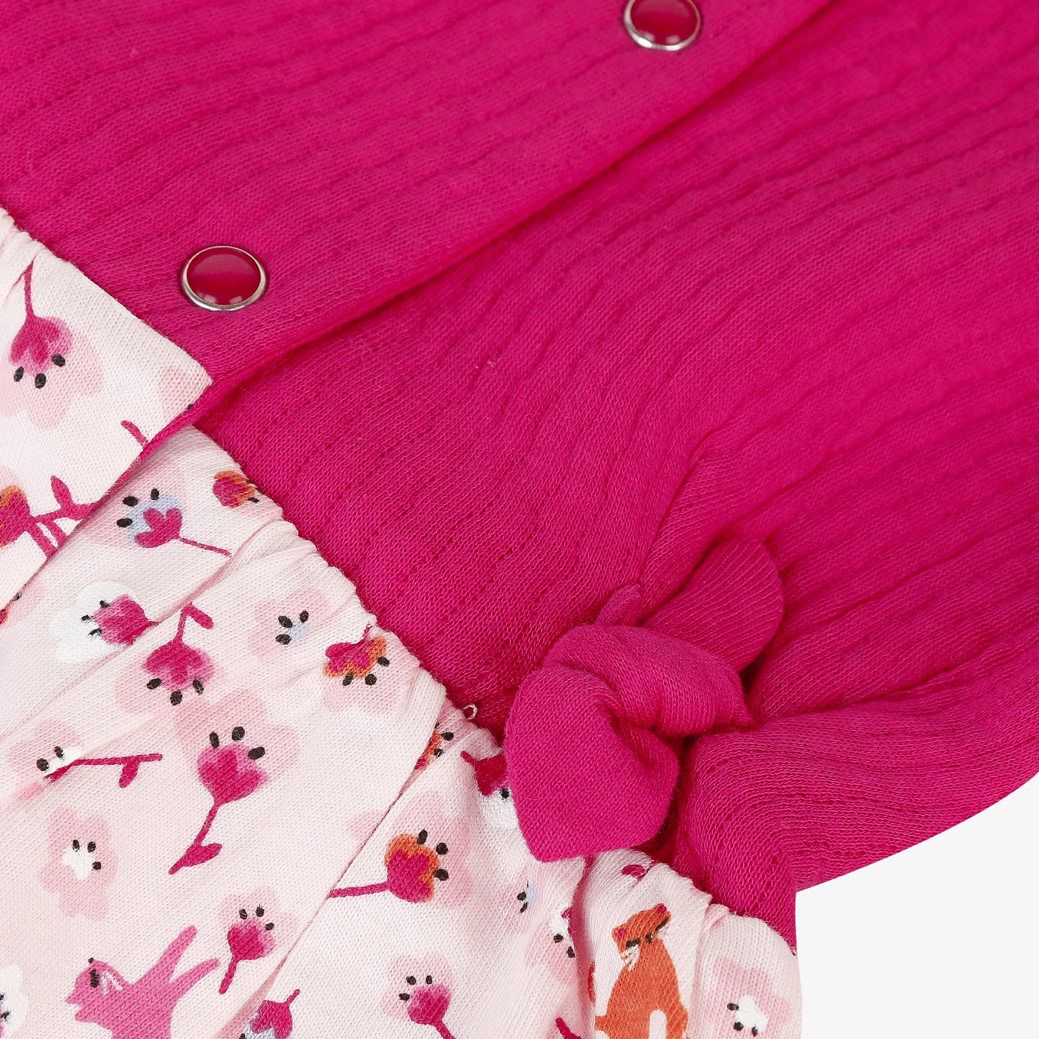 Newborn girl pink dress with floral print and bows